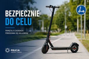 Na zdjęciu znajduje się hulajnoga stojąca na drodze